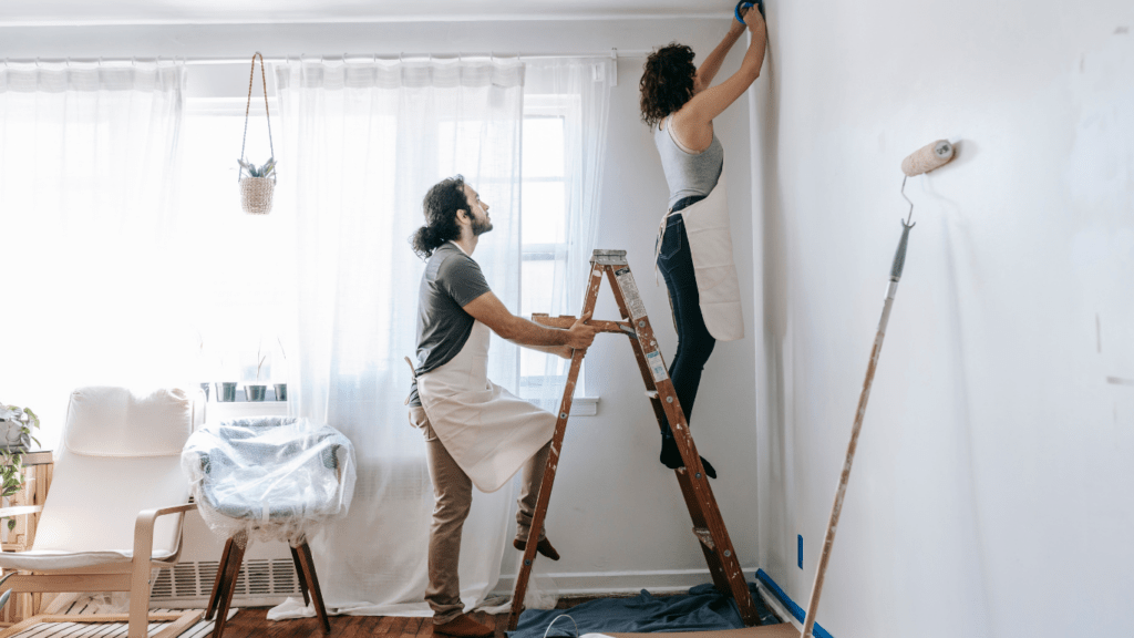 a person painting the house