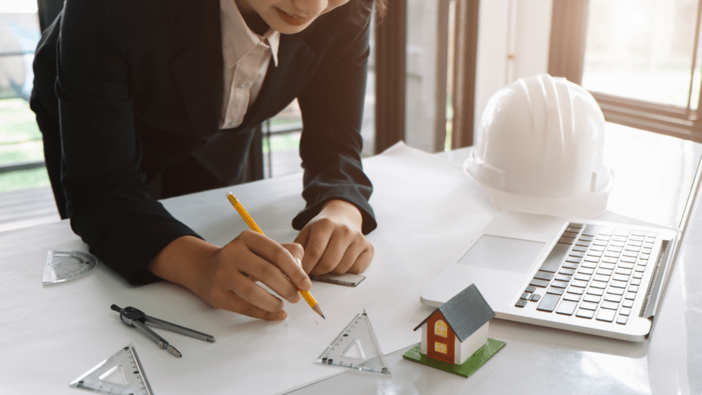 Female Architect Working on Blueprint