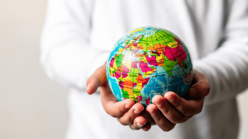 a person holding a globe